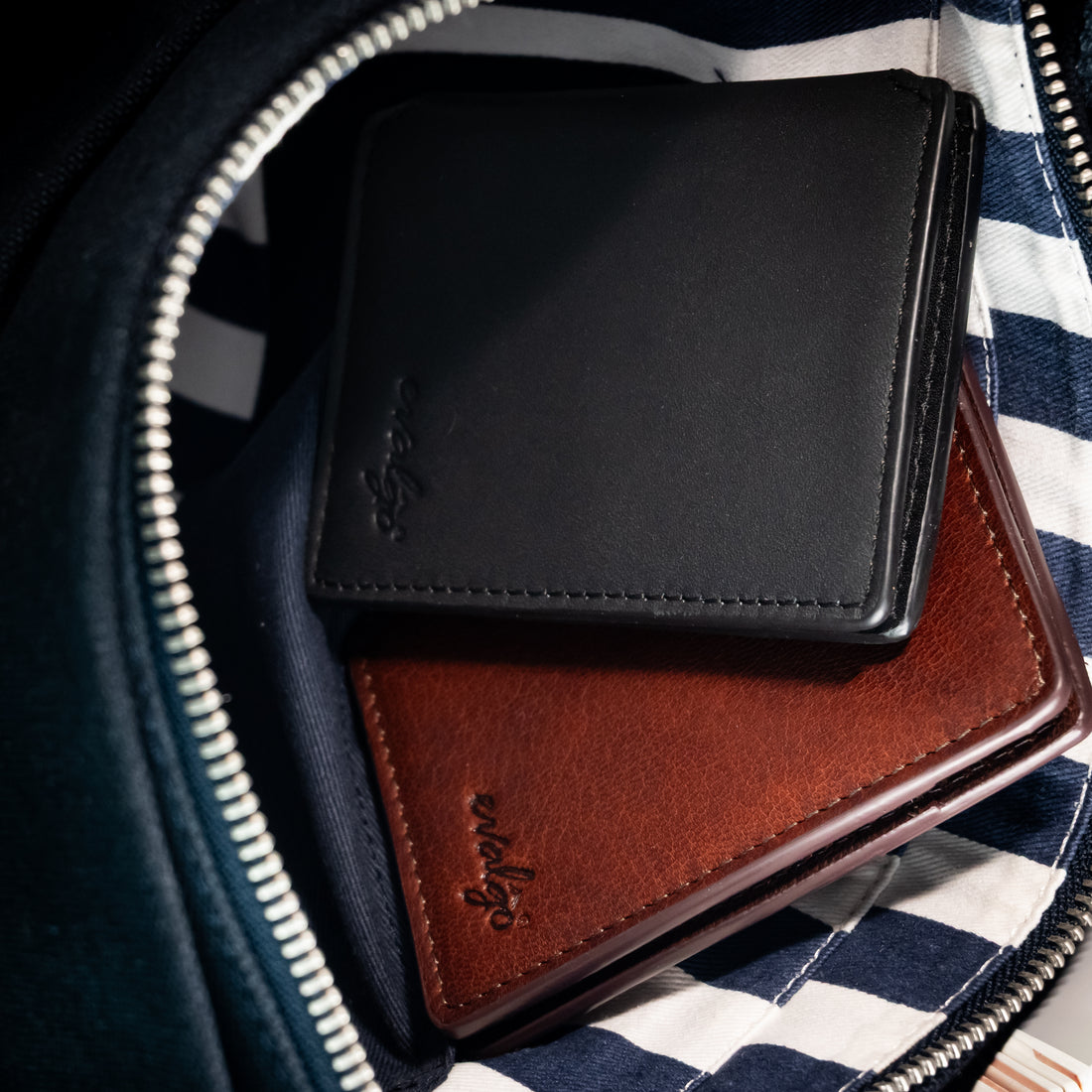The Snap wallet slipping into a front pocket, showing its slim profile